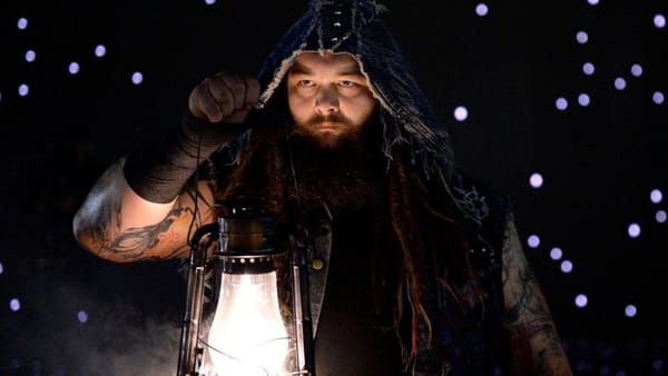 bray wyatt holding a lantern.